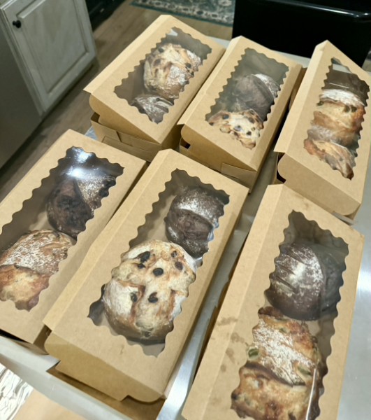 Sourdough loaves packaged in kraft boxes with window lids